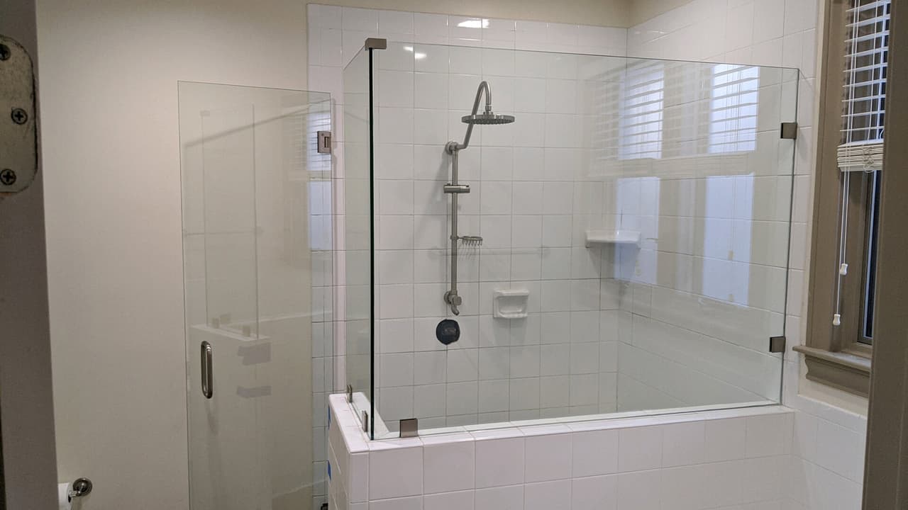 Custom glass shower enclosure installed by Door Pro Plus for a Marble Falls, TX homeowner