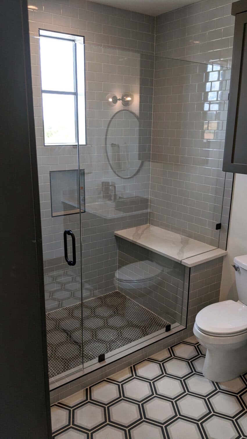 Tempered glass shower enclosure installed by Door Pro Plus in a Hill Country home