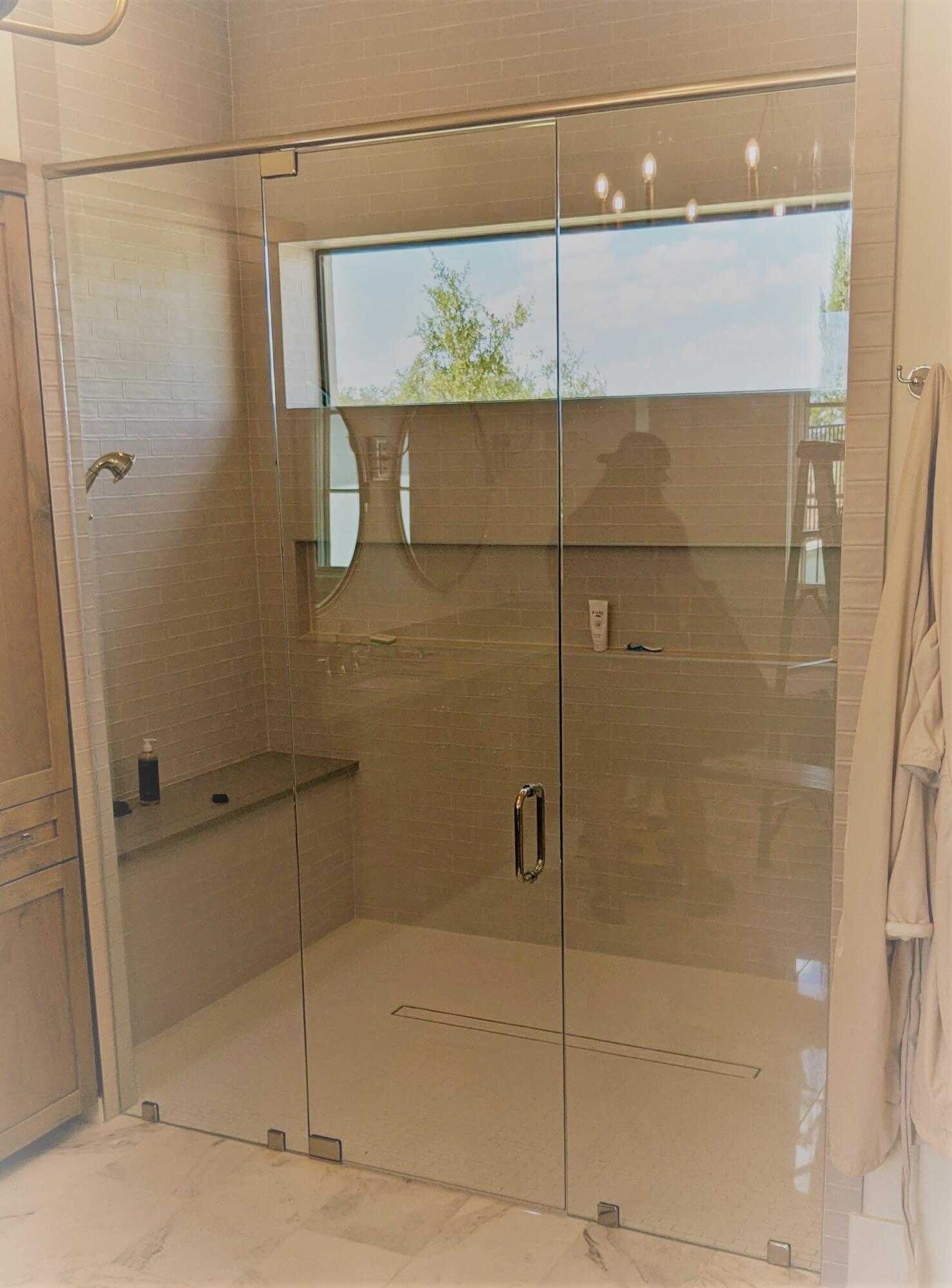 Custom frameless glass shower enclosure installed by Door Pro Plus in a Marble Falls, TX bathroom