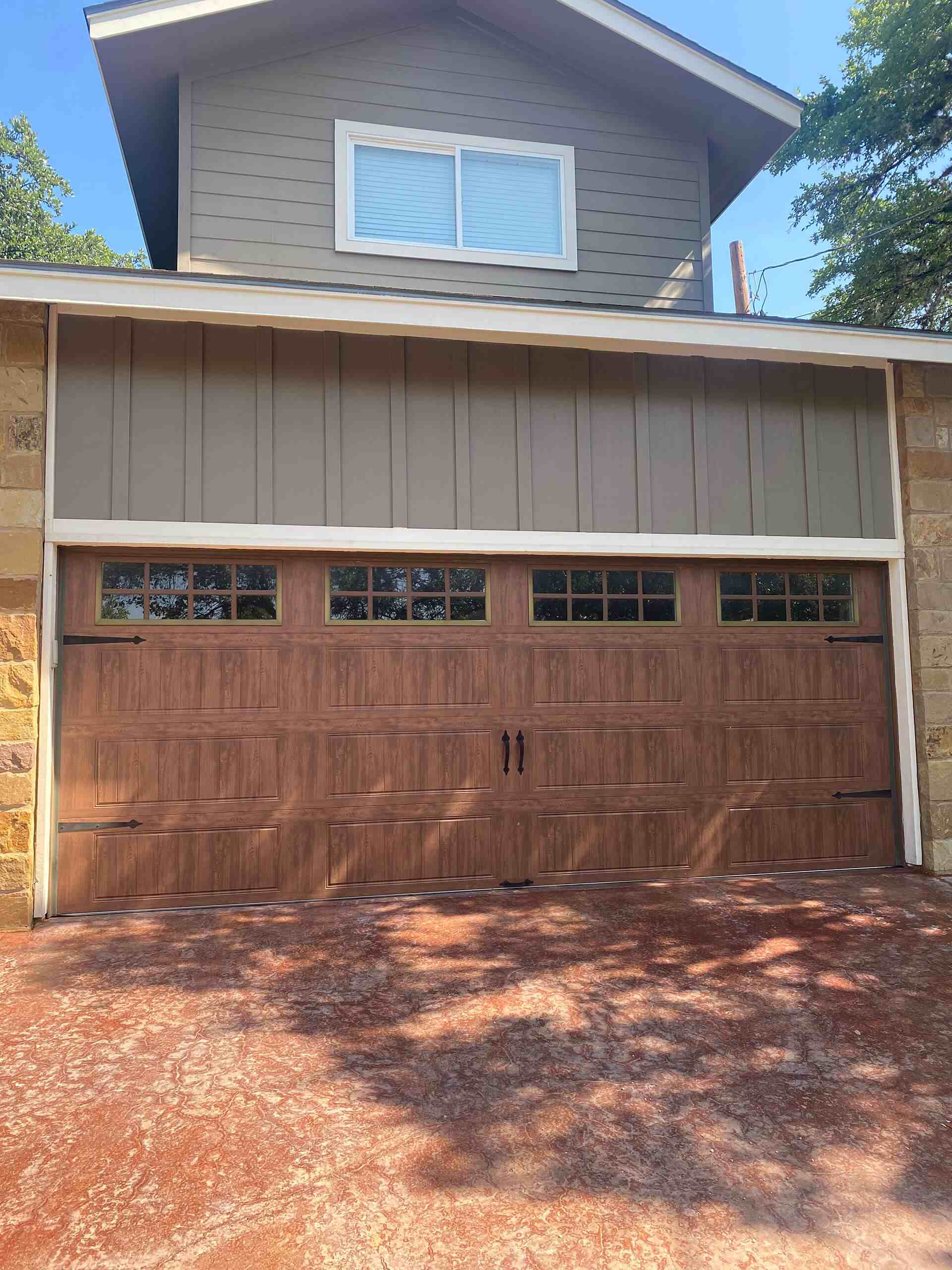 Garage door with a professionally installed opener system serviced by Door Pro Plus in Marble Falls, TX